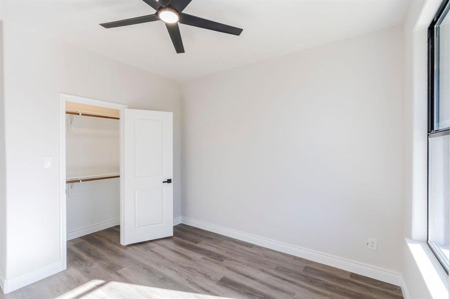 Bedroom featuring a closet, ceiling fan, and light wood-type flooring