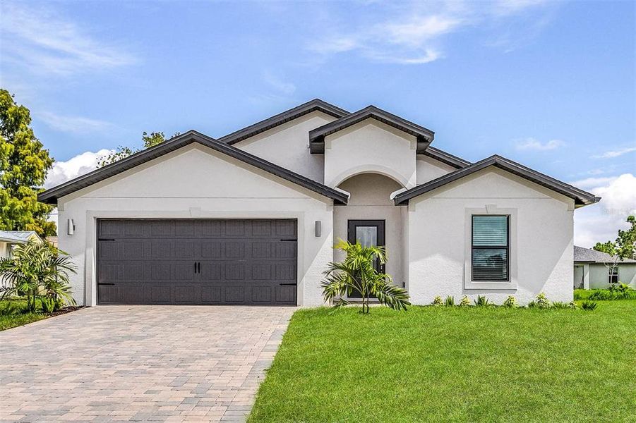 Front exterior of a new home in , Port Charlotte, FL, highlighting curb appeal (Image 15).