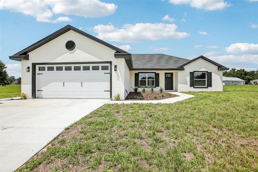 Front exterior of a new home in , Bushnell, FL, highlighting curb appeal (Image 28).
