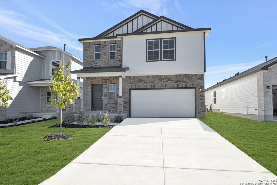 Front exterior of a new home in Winding Brook, San Antonio, TX, highlighting curb appeal (Image 25).