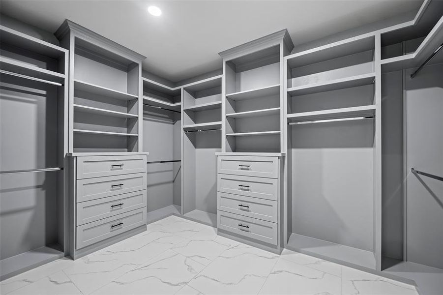 The built-in custom shelving & drawers in the oversized Primary Closet.