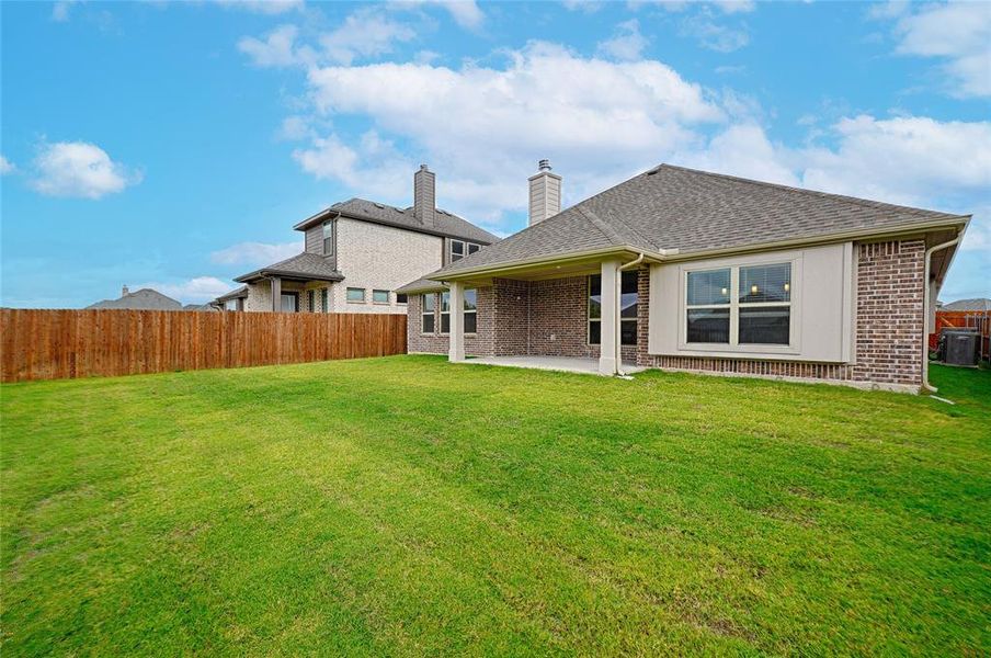 Exterior details and patio area of a home in Parks at Panchasarp Farms, Burleson (Image 26).