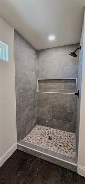 Bathroom featuring a shower stall, dark wood-type flooring, and recessed lighting Bathroom featuring a shower stall, dark wood-type flooring, and recessed lighting