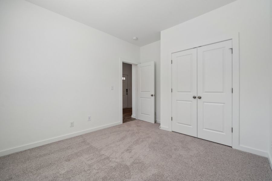 A hallway with white doors. A hallway with white doors.