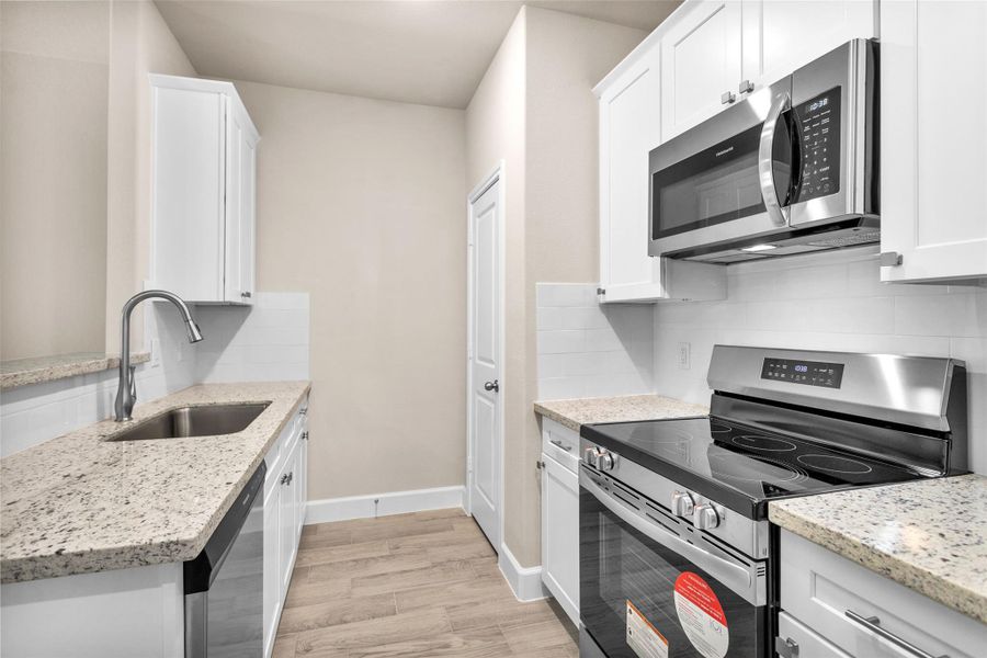 Furnished interior view inside a new home in , Willis (Image 8).