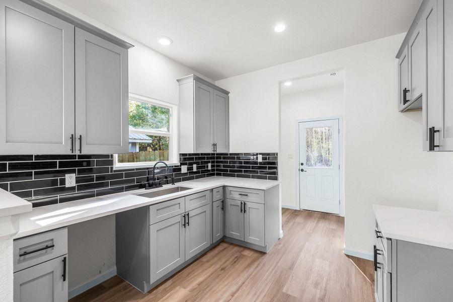 Beautiful design Kitchen with Black Tile Backsplash