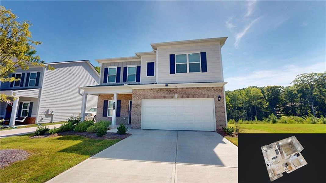 Front exterior of a new home in Evergreen at Lakeside, Temple, GA, highlighting curb appeal (Image 2). Front exterior of a new home in Evergreen at Lakeside, Temple, GA, highlighting curb appeal (Image 2).