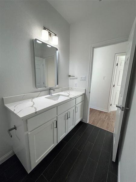 Bathroom with vanity and hardwood / wood-style floors