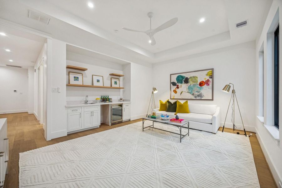 Upstairs media room with 7 1/2 Inch Wide Plank, European White Oak Floors, Coffered Ceiling and a MinkaAire Roto XL 62" 3 Blade Ceiling Fan.
