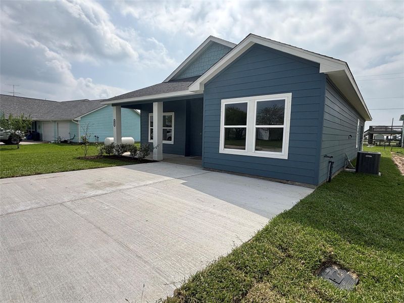 Front exterior of a new home in , Palacios, TX, highlighting curb appeal (Image 22). Front exterior of a new home in , Palacios, TX, highlighting curb appeal (Image 22).