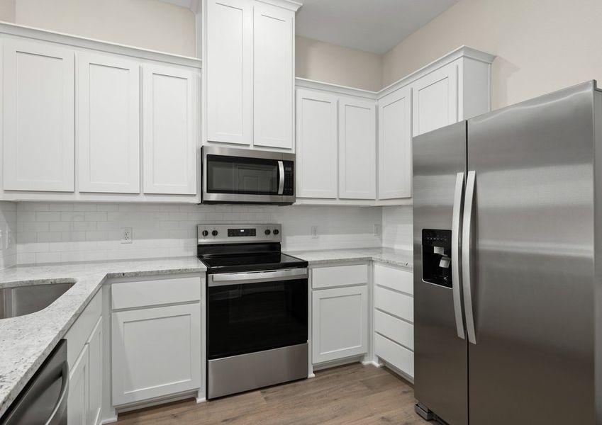 The kitchen has a beautiful tile backsplash.