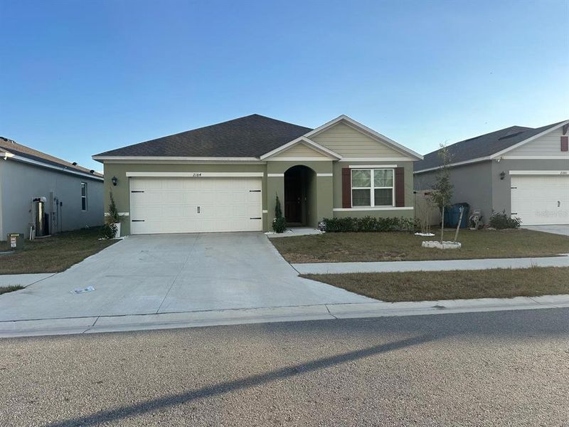 Front exterior of a new home in Deer Run, Davenport, FL, highlighting curb appeal (Image 1). Front exterior of a new home in Deer Run, Davenport, FL, highlighting curb appeal (Image 1).