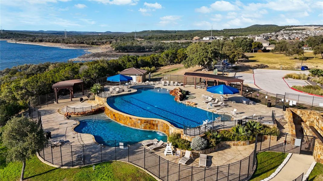 A community pool complex overlooks the sparkling lake and surrounding hillsides. A community pool complex overlooks the sparkling lake and surrounding hillsides.