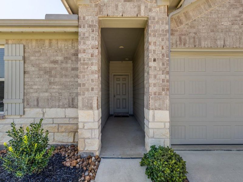 Exterior details and patio area of a home in Grand Pines, Magnolia (Image 3).