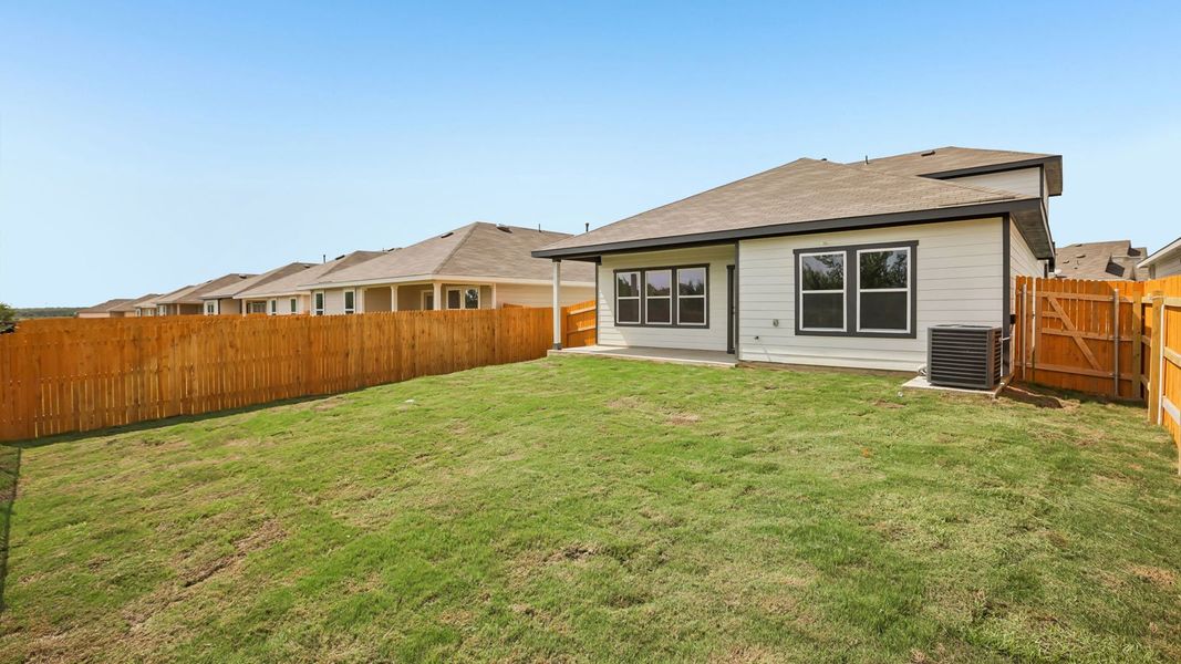 Exterior details and patio area of a home in Prairie Lakes, Buda (Image 22).