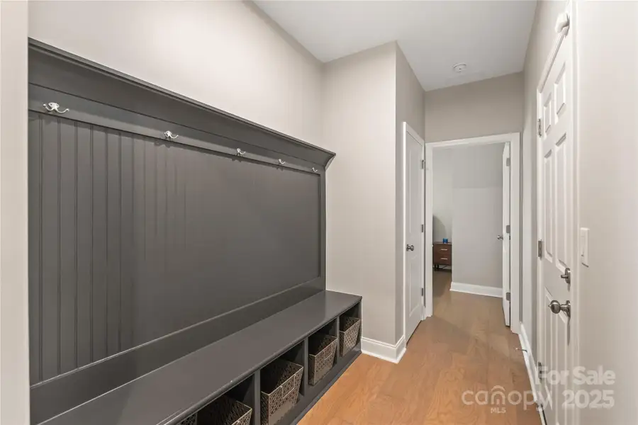 Huge drop zone in hall off garage entrance and the tucked away main level guest room adds a nice and useful touch Huge drop zone in hall off garage entrance and the tucked away main level guest room adds a nice and useful touch