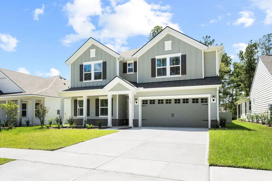 Front exterior of a new home in Waterways, Richmond Hill, GA, highlighting curb appeal (Image 26).