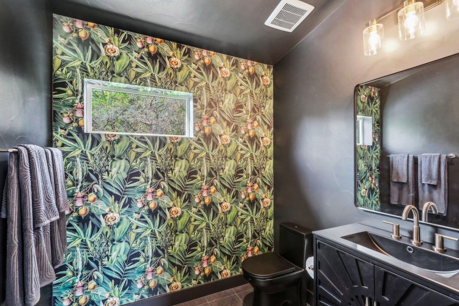 Bathroom featuring vanity, toilet, and tile patterned floors Bathroom featuring vanity, toilet, and tile patterned floors
