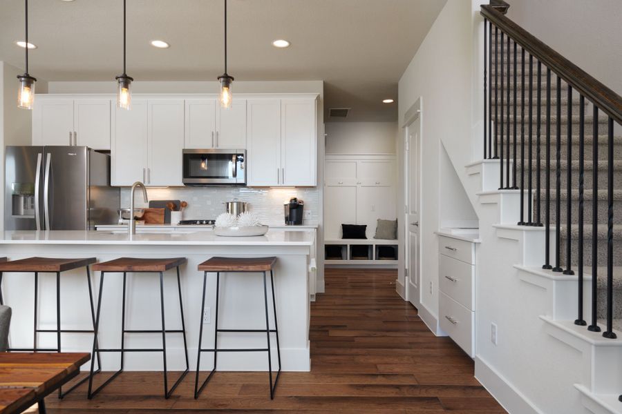 Spacious kitchen with pendant flooring