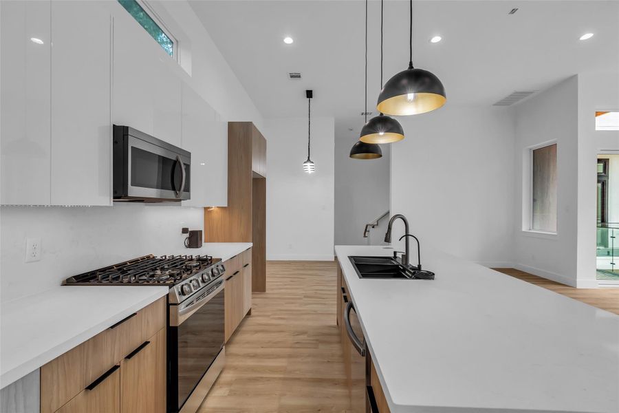 A closer look at the kitchen reveals its thoughtful layout, designed for functionality and ease of movement during cooking and entertaining. A closer look at the kitchen reveals its thoughtful layout, designed for functionality and ease of movement during cooking and entertaining.