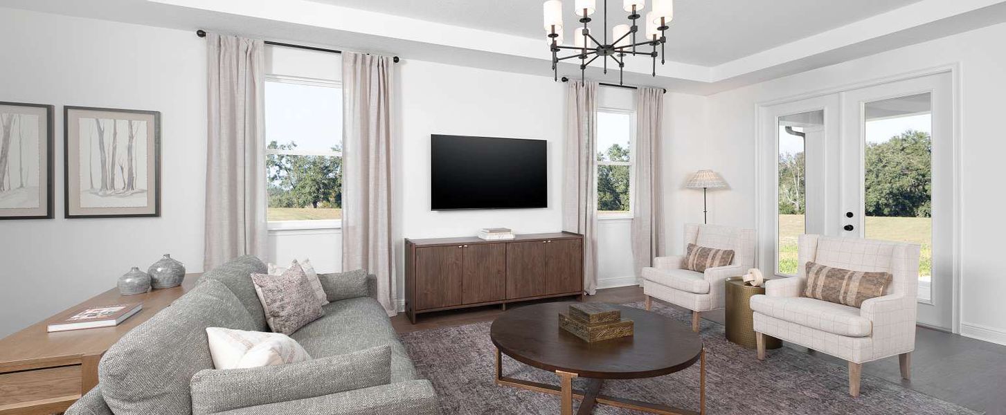 Furnished interior in a model home at Oakfield Trails Signature in Parrish (Image 17).