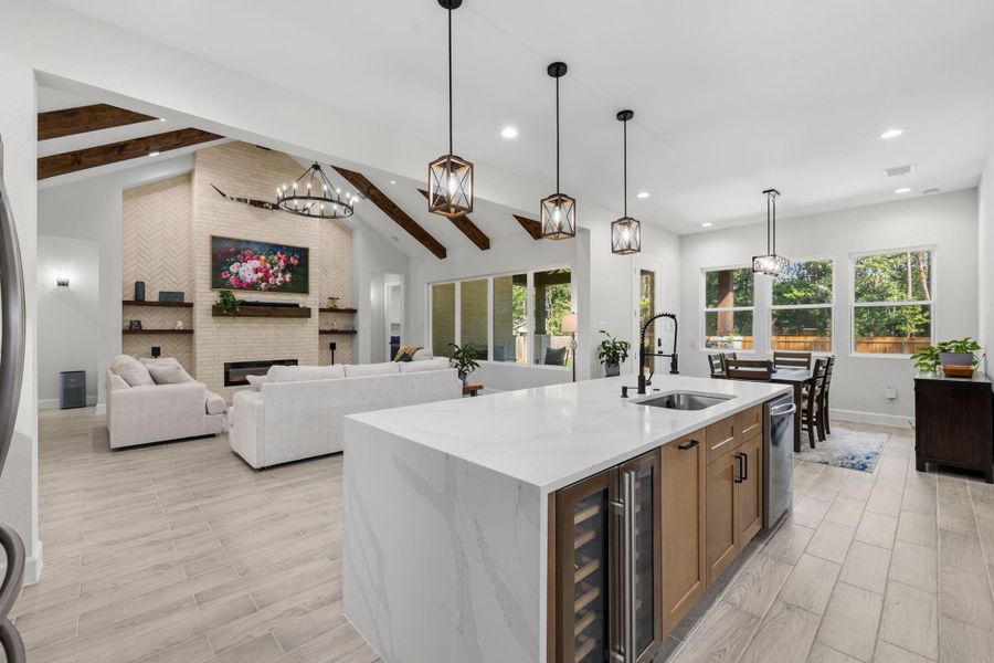 KITCHEN II - Kitchen opens directly to the main living area, offering an inviting layout with generous prep space and an oversized island ideal for gathering.