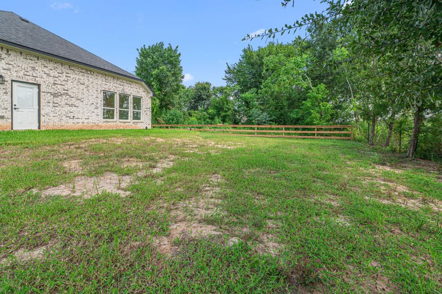 Another angle of spacious backyard.