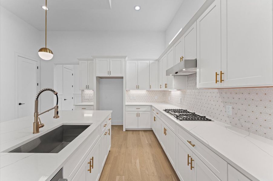 Kitchen with shaker cabinets and ample storage. *Previous Brownstone Living project, selections and floor plans may vary.*