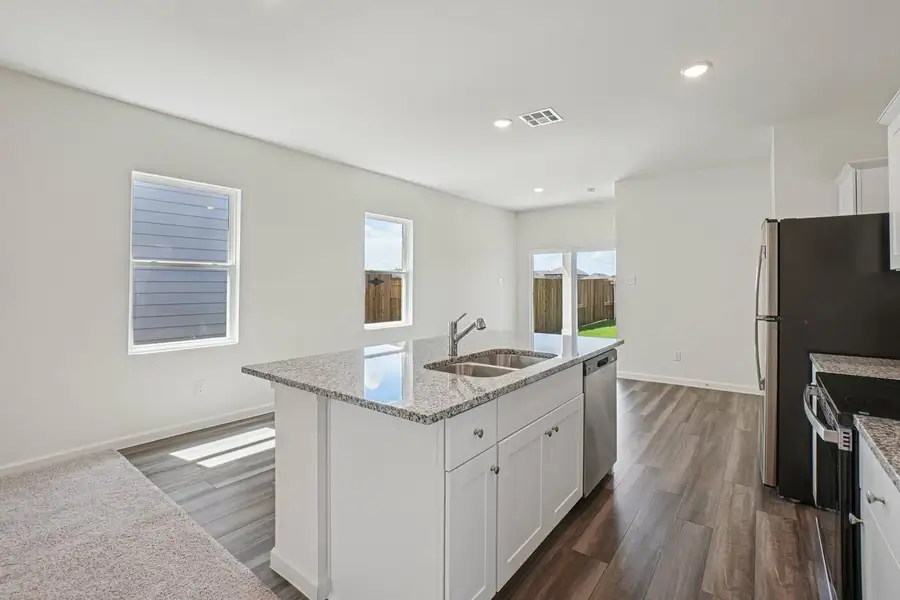 Furnished interior in a model home at Williams Landing in Waller (Image 19).