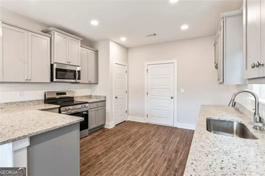 Furnished interior view inside a new home in , Hampton (Image 8).