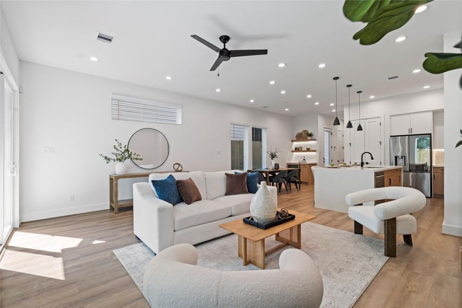 From prepping dinner to catching up on the couch, this layout was made for connection. The kitchen flows seamlessly into the living area, while natural light and soft finishes make the space feel open, grounded, and ready to be lived in.