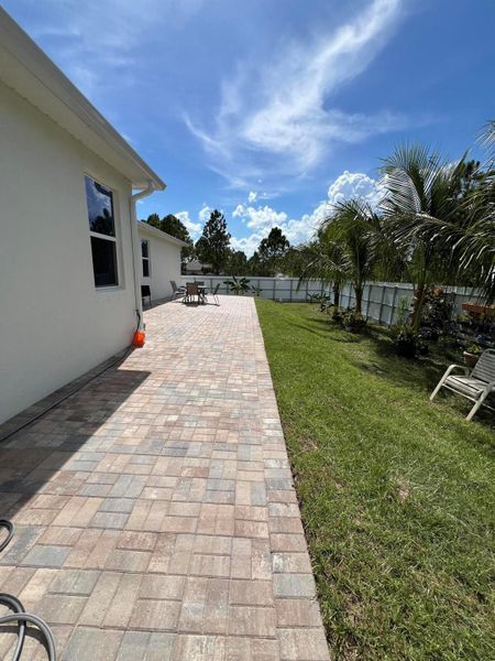 Front exterior of a new home in , Palm Bay, FL, highlighting curb appeal (Image 24).