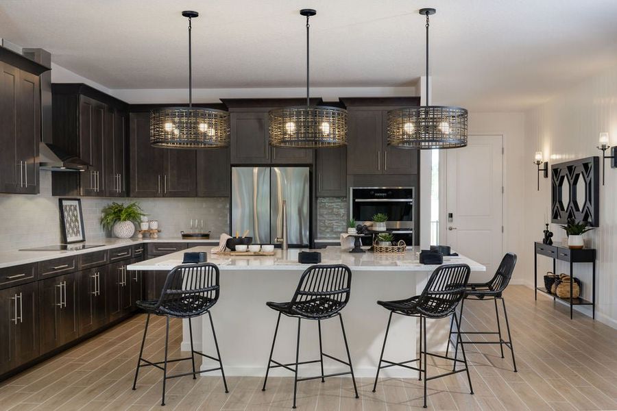 Representative furnished interior of a home built from the Hampton II by Park Square Residential in Brighton, Venice (Image 6).