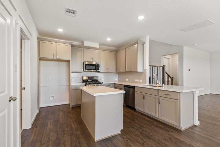 Furnished interior view inside a new home in Sunterra, Katy (Image 11).