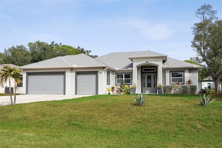 Front exterior of a new home in , North Port, FL, highlighting curb appeal (Image 1).