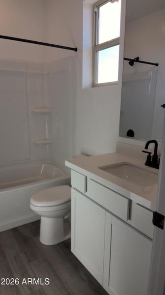 Downstairs guest suite bath with quartz