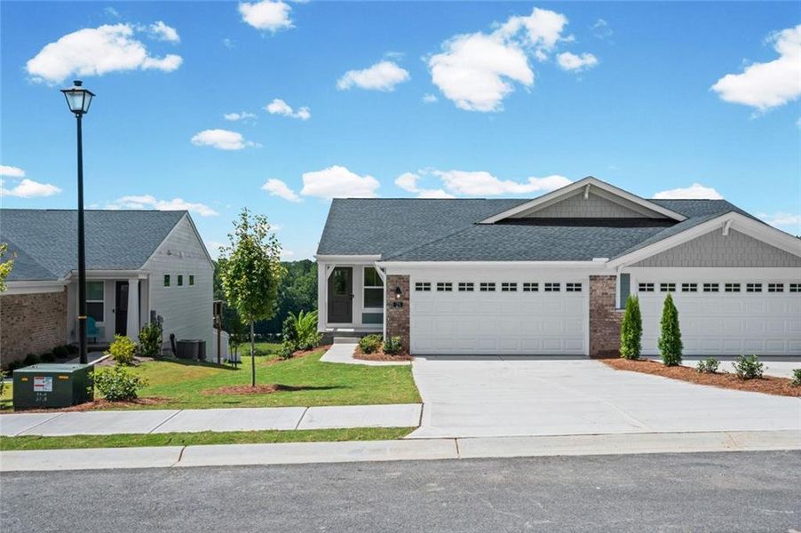 Front exterior of a new home in Villas at Gold Creek, Dawsonville, GA, highlighting curb appeal (Image 22).