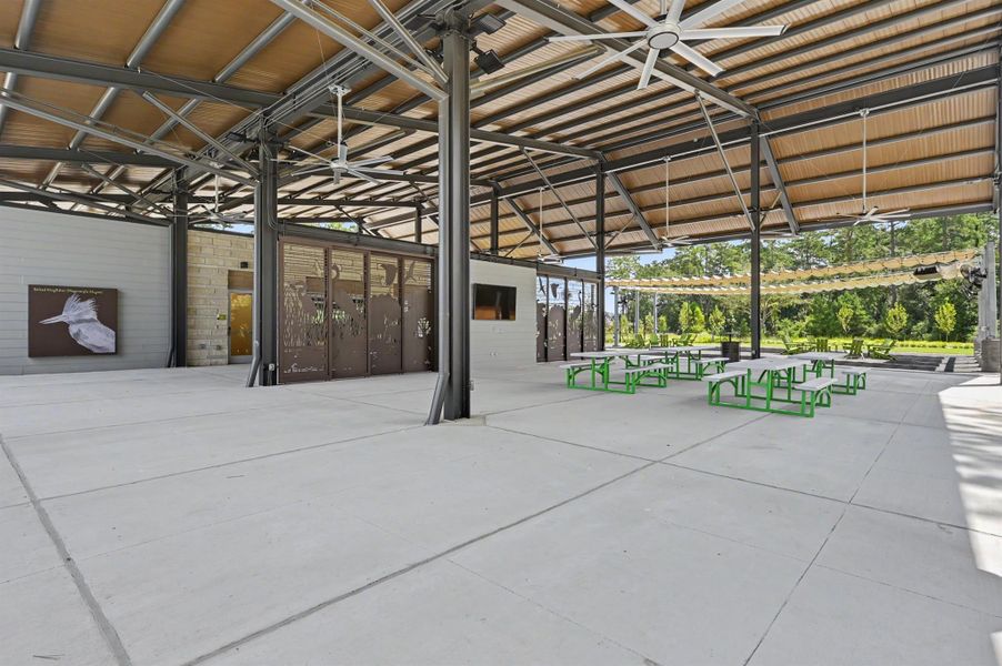 This covered area has many picnic tables and large overhead fans! What a fun spot! This covered area has many picnic tables and large overhead fans! What a fun spot!
