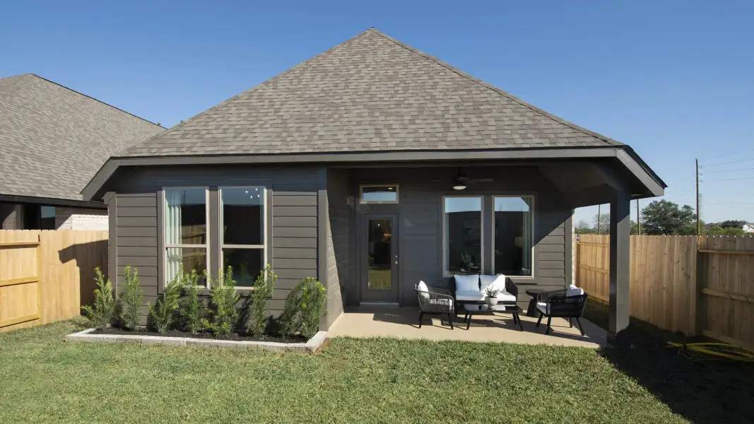 Exterior details and patio area of a home in Woodhavyn, Magnolia (Image 25).