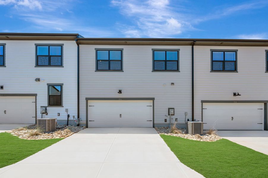 Front exterior of a new home in Seven Oaks, Belmont, NC, highlighting curb appeal (Image 2). Front exterior of a new home in Seven Oaks, Belmont, NC, highlighting curb appeal (Image 2).