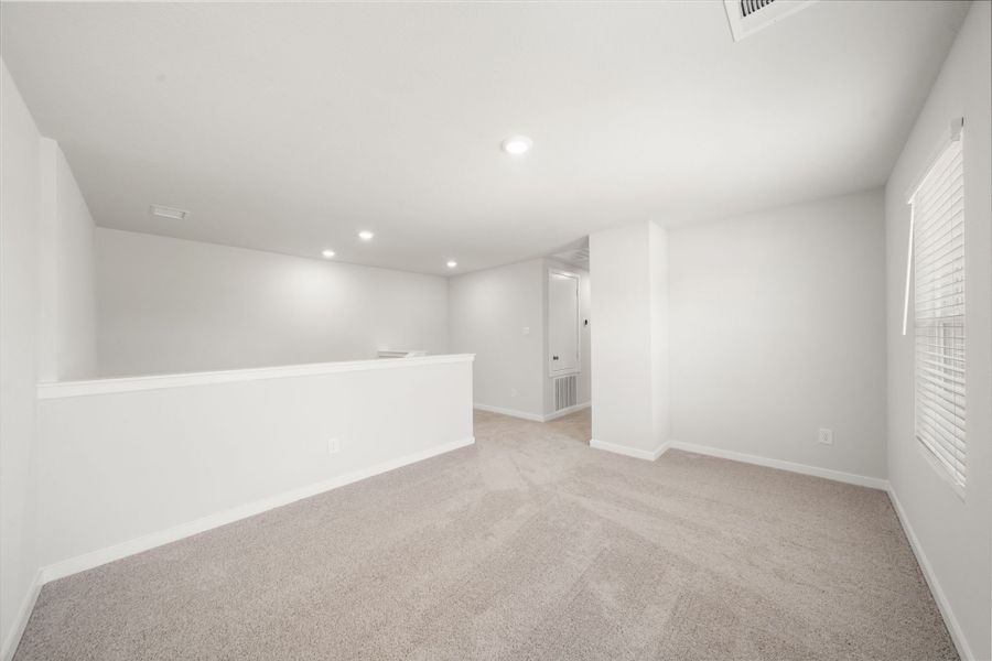 A long hallway with white walls.