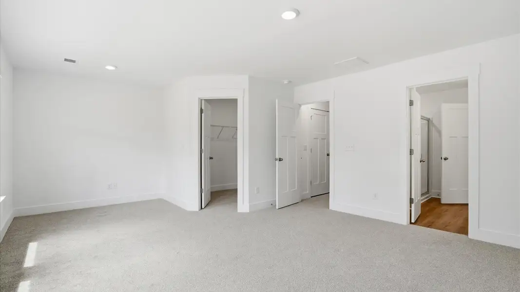 Memorable mornings begin in this tasteful and thoughtfully crafted primary suite located near Downtown Greenville