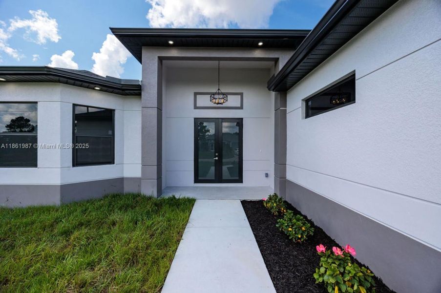 Front exterior of a new home in , Lehigh Acres, FL, highlighting curb appeal (Image 18). Front exterior of a new home in , Lehigh Acres, FL, highlighting curb appeal (Image 18).