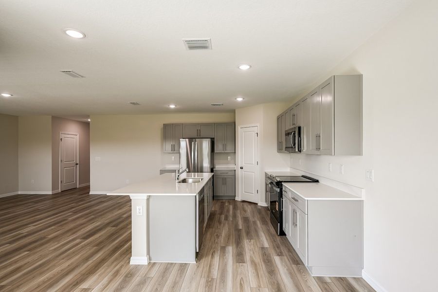 Furnished interior view inside a new home in Pasadena Ridge, Dade City (Image 5).