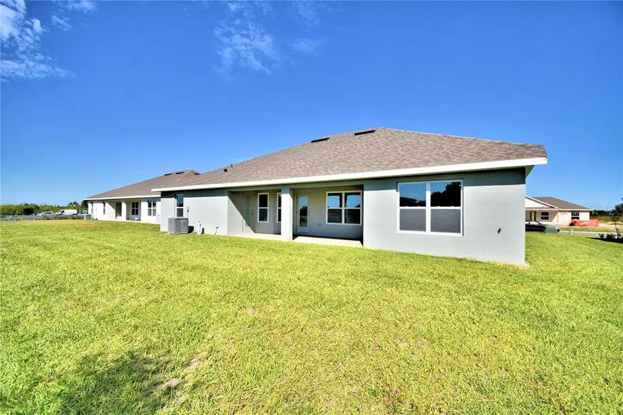 Exterior details and patio area of a home in Cadence Crossing, Auburndale (Image 2). Exterior details and patio area of a home in Cadence Crossing, Auburndale (Image 2).