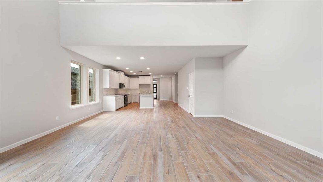 Unfurnished living room featuring light hardwood / wood-style flooring