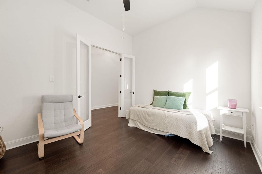Rich hard surface flooring define this comfortable and inviting bedroom space. Rich hard surface flooring define this comfortable and inviting bedroom space.
