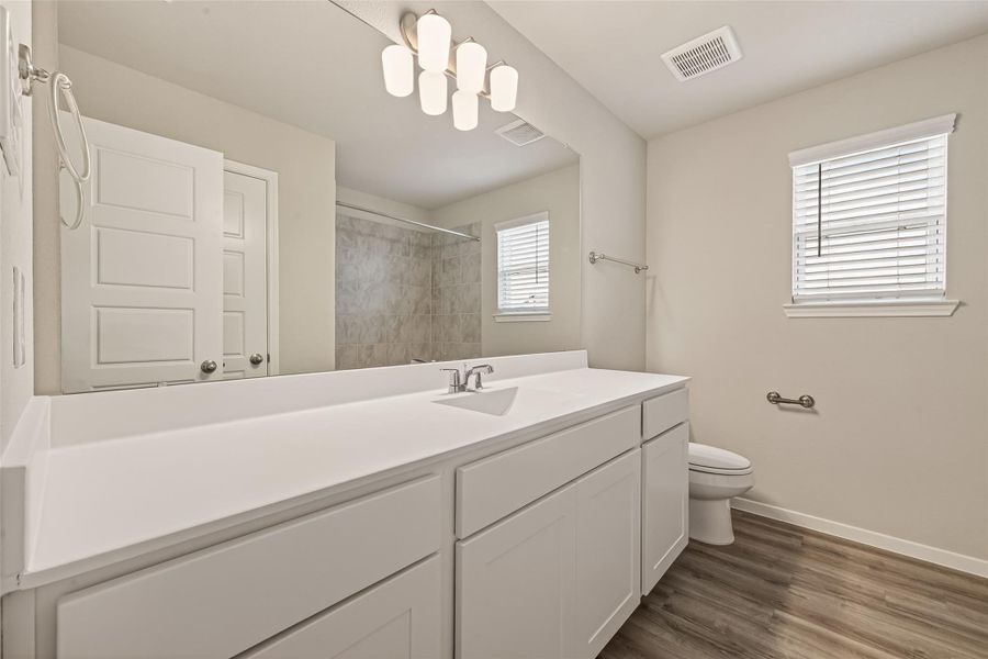 Furnished interior view inside a new home in Sunterra, Katy (Image 9).