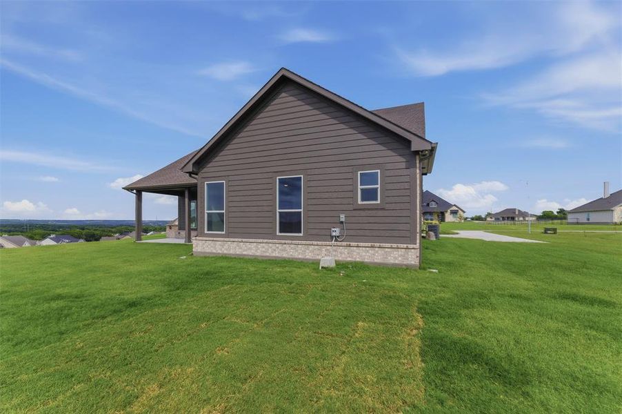 Exterior siding in a neutral tone with a contrasting stone base Exterior siding in a neutral tone with a contrasting stone base