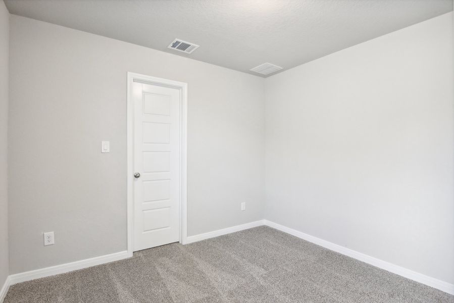 Guest bedroom in the Medina floorplan at a Meritage Homes community.